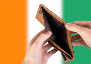 Empty Wallet with Flag of Ivory Coast. Recession and Financial Crisis to come with more debt and federal budget deficit?