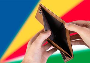 Empty Wallet with Flag of Seychelles. Recession and Financial Crisis to come with more debt and federal budget deficit?