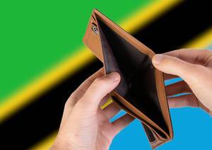 Empty Wallet with Flag of Tanzania. Recession and Financial Crisis to come with more debt and federal budget deficit?