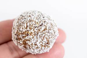 Energy Balls with Coconut on the hand