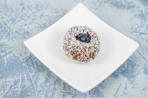 Energy Balls with Date Palm fruits Almonds Walnuts and Coconut and Blueberry