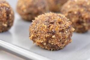 Energy Balls with Walnuts Palm Dates and Sesame on the plate
