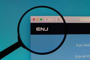 Enjin Coin logo under magnifying glass