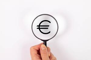 Euro symbol under magnifying glass