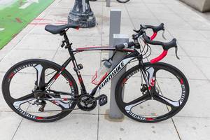 Eurobike speed road bicycle in black and white with red details parked in Downtown Chicago