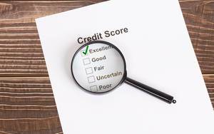 Excellent Credit Score result with magnifying glass