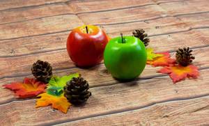 Fall decor of maple leaves and apples