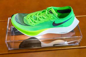 Fast racing shoe Nike ZoomX Vaporfly NEXT% in green on display at the Chicago Marathon 2019 Expo