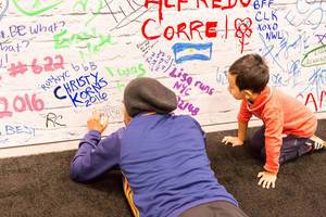 Father and Son signing wall at Marathon Expo New York