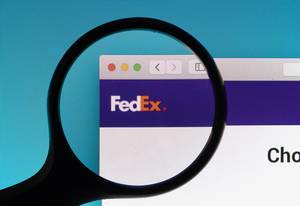 FedEx logo under magnifying glass