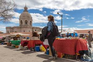 Feira da Ladra Flea Market with National Pantheon in the Background in Lisbon, Portugal