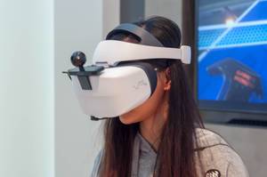 Female fair visitor using a Hauwei VR2 headset