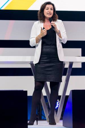 Figure shot of the German Minister of State for Digitalisation, Dorothee Bär, gesticulating while addressing the audience of the Digital X event at the Koelnmesse