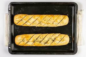Flat lay above baked Bread Bruschetta on the baking tray