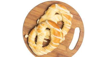 Flat lay above bakery Pretzels isolated on the wooden board