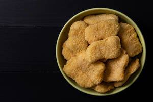 Flat lay above Chicken Nuggets in the bowl