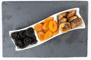 Flat lay above Dried Plums Peaches and Figs