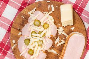 Flat lay above Ham Pickles and Cheese with Sandwich Bread