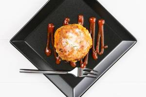 Flat lay above Meatball with melting cheese on the white plate