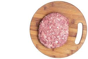 Flat lay above Minced Meat on the kitchen wooden board