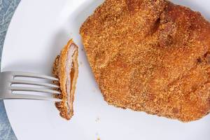 Flat lay above served Breaded Meat on the plate