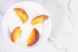 Flat lay above Sliced Peaches with Greek Yogurt (Flip 2019)