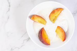 Flat lay above Sliced Peaches with Greek Yogurt