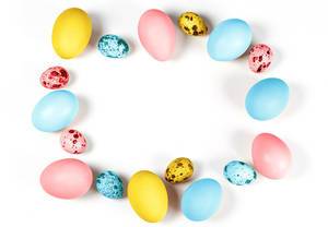 Frame-of-multicolored-quail-and-chicken-eggs-on-a-white-background-free-space-for-Easter-greetings.jpg