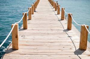 Freedom: Wooden bridge to the sea.
