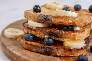 French Toast with Banana and Blueberries and Honey