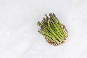 Fresh Asparagus in the woven basket