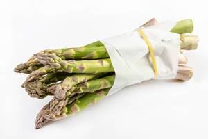 Fresh Asparagus packed with the paper
