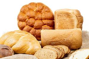 Fresh bread of different varieties on burlap (Flip 2020)