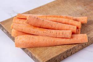 Fresh Domestic Carrots sliced on the wooden board (Flip 2019)