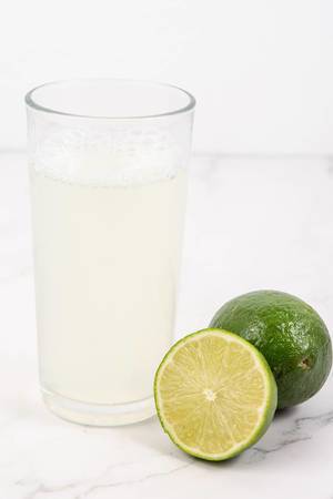Fresh-Green-Limes-juice-on-the-white-table.jpg