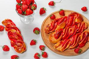Fresh homemade buns with strawberry jam and fresh strawberries (Flip 2019)