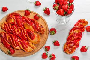 Fresh homemade buns with strawberry jam and fresh strawberries