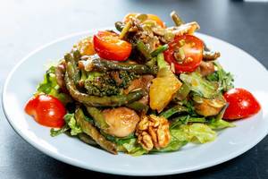 Fresh mix of vegetables, mushrooms and nuts in diet salad