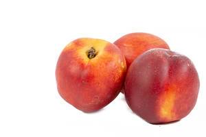 Fresh Peaches isolated above white background