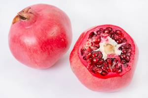 Fresh Pomegranate isolated above white background (Flip 2019)