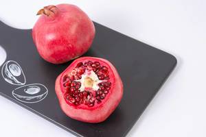 Fresh Pomegranate on the black tray (Flip 2019)