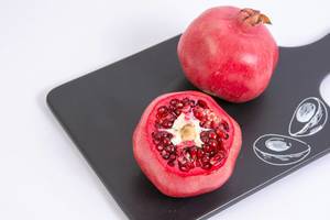 Fresh Pomegranate on the black tray