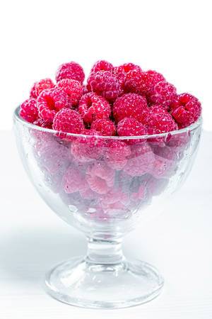 Fresh raspberries in a glass bowl