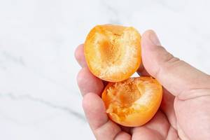 Fresh raw Apricots in the hand (Flip 2019)