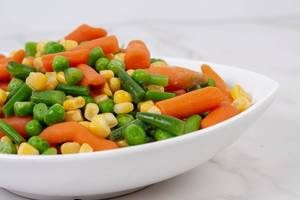Fresh raw Carrot Peas Corn and Green Beans in the bowl (Flip 2019)