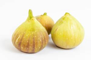 Fresh raw Figs isolated above white background