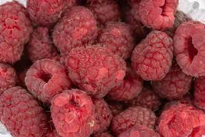 Fresh Raw Raspberries closeup macro image