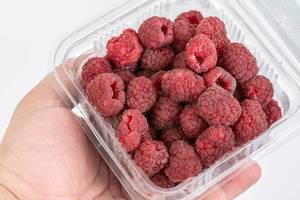 Fresh Raw Raspberry in the market box