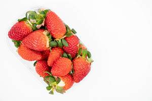 Fresh Raw Strawberries above white background with copy space (Flip 2020)