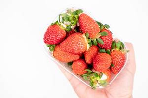 Fresh Raw Strawberries in the plastic box with copy space (Flip 2020)